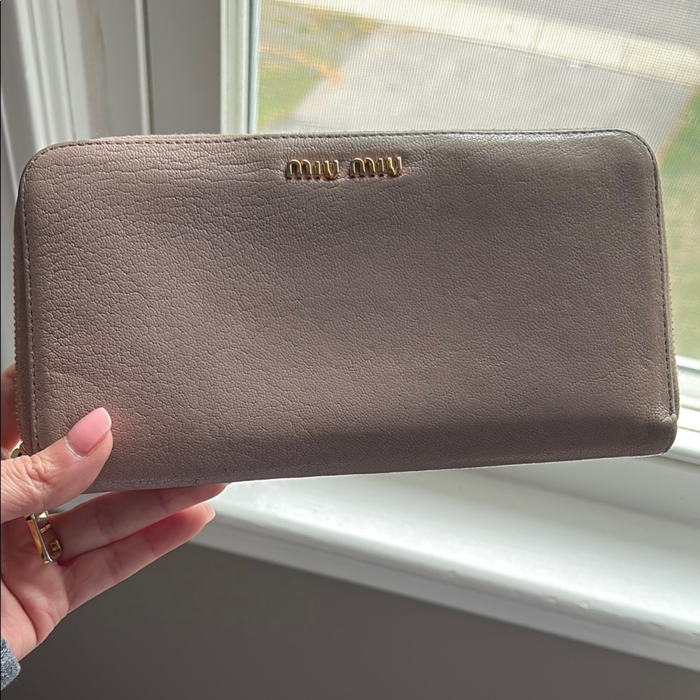 Authentic Miu Miu pink Leather zip around Wallet.